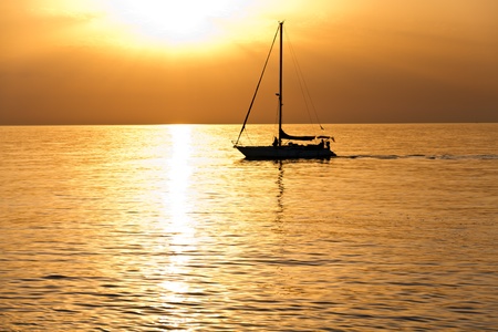 Sailboat at dawn, taken from Barcelona on the Mediterranean sea.の写真素材