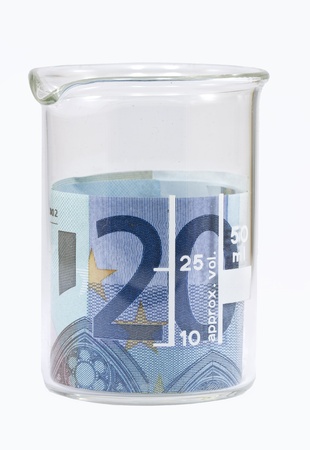Twenty euro banknote in white beaker Isolated on white backgroundの写真素材
