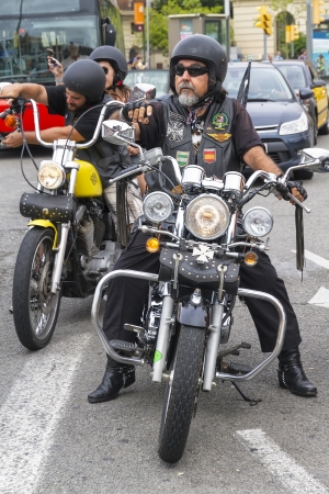 BARCELONA, SPAIN - JULY 08  Unidentified persons with a Harley Davidson motorbike at an exhibition during BARCELONA HARLEY DAYS 2012, on July 08, 2012, Barcelona, Spain のeditorial素材
