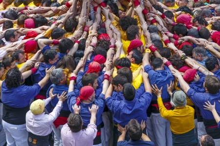 BARCELONA, SPAIN - MAY 19: Some unidentified people called Castellers do a Castell or Human Tower, typical tradition in Catalonia, on May 19, 2013 in Barcelona, Spain.のeditorial素材