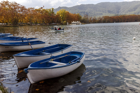Lake Banyoles is the largest lake in Catalonia, Tourists enjoy the good weather and relax for boating and wooded paths.のeditorial素材