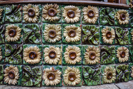 Comillas, Spain - August 24, 2016: La Villa Quijano, popularly known as El Capricho, is a modernist building in Comillas. Designed by Antoni Gaudi Detail ceramic floral motif with sunflowersのeditorial素材