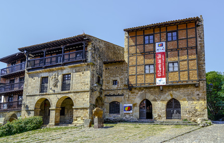 Santillana Del Mar, Spain - August 23, 2016: The Houses of Aguila and Parra are in the Plaza Mayor, in the historic center of Santillana del Mar, next to City Hall. Cantabriaのeditorial素材