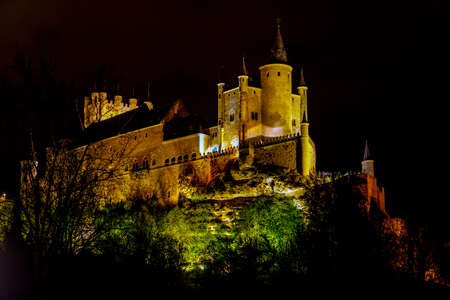 Alcazar of Segovia as the famous landmark aerial view at night in Spainの写真素材