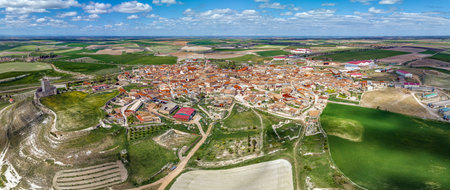 Aerial view Panoramic of the town of Tiedra in the province of Valladolid in Spain, with surrounding agricultural fields. Highlighting the tower of the castle on the typical houses of the townのeditorial素材