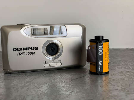 Indore, India: June 4,'2020: Vintage Olympus film camera. Kodak film reels. Retro camera.のeditorial素材