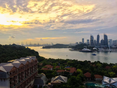 Singapore, July 17,'2020: Aerial drone view of Singapore city skyline at sunset. 
Selective focus. Landscape shot of Singapore.のeditorial素材