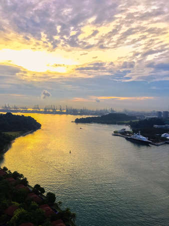 Singapore, July 17,'2020: Aerial drone view of Singapore city skyline at sunset. Selective focus. Landscape shot of Singapore.のeditorial素材