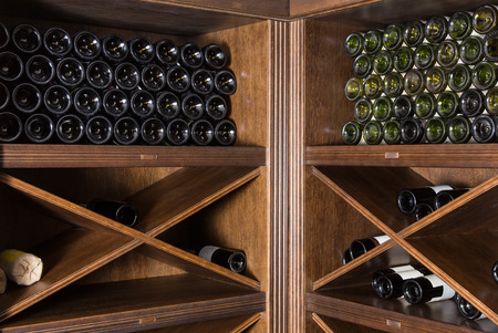 Wine cellar with bottles on wooden shelvesのeditorial素材