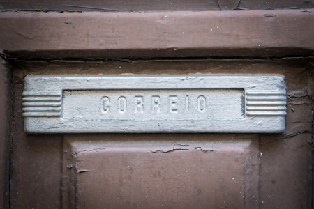 Old rusty mailbox with the word "mail" - in Portugese   "correio"の写真素材
