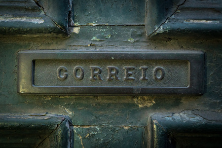Old rusty mailbox with the word "mail" - in Portugese   "correio"の写真素材
