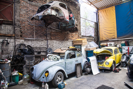 Mexico city, Mexico - march 2nd, 2012:  Car repair station with popular in Mexico old Volkswagen Beetle cars, in Mexico DF, Mexicoのeditorial素材