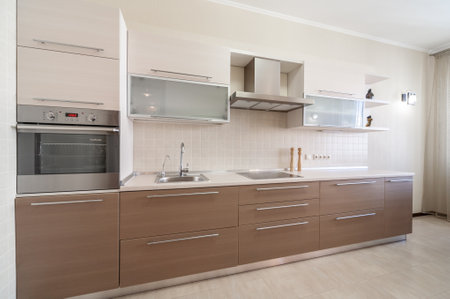 Modern kitchen minimalictic interior with beige artificial stone pannels. Kitchen design conceptの写真素材