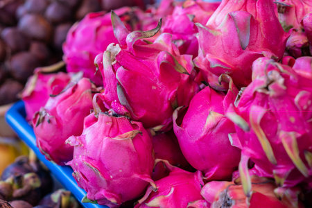 Close up of a Dragon fruit sold on a market in Indonesia. Nutrition and natural poducts growing...
