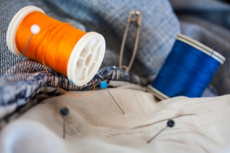 thread reels on blue jeans