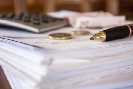 financial composition on the table with money, calculator and pen