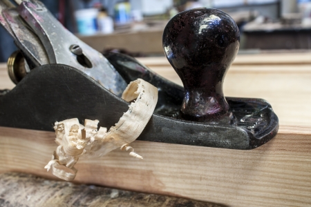 wood plane with construction background