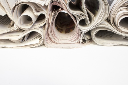 Various newspapers over white backgroundの写真素材