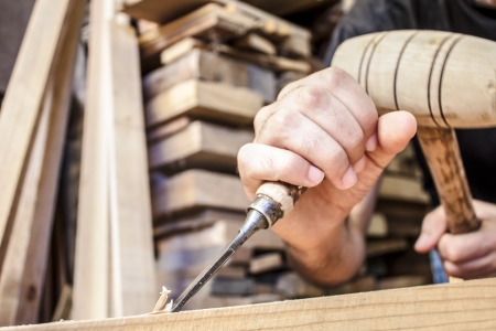 gouge wood chisel carpenter tool working wooden backgroundの写真素材