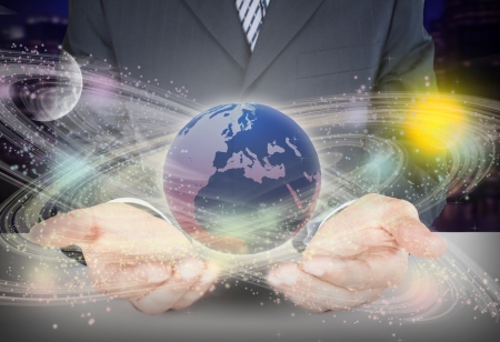 holding earth globe in his hands の写真素材