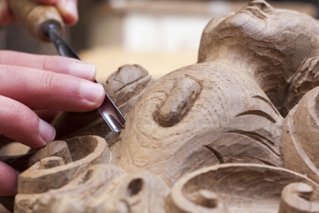 craftsman carving with a gougeの写真素材