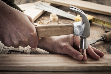 woodworker hammer a nailの写真素材