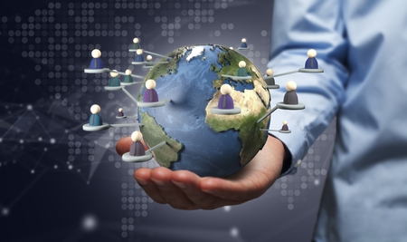 hand holding  people around earth globe