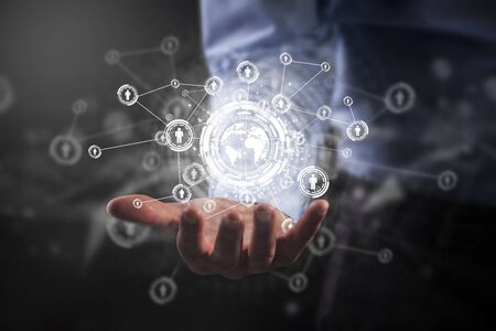 Businessman holding social media network icons structureの写真素材