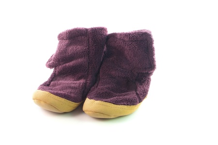 A pair of warm cosy slippers on isolated backgroundの写真素材