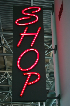 Red neon light as advertisement for a Shopの写真素材
