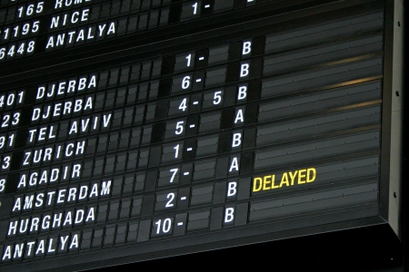 Airport departure board in terminal with flight informationのeditorial素材