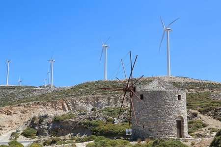 A new and old wind mill farm in Greeceの写真素材
