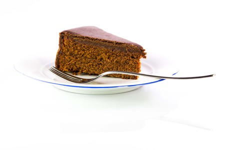 The famous Sacher Cake from Vienna on a white plateの写真素材