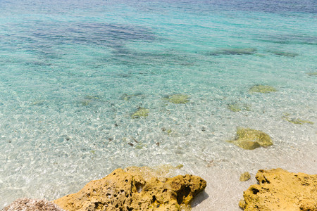 Beautiful turquoise sea water on coast of Is Arutas in Sardinia island, Italy