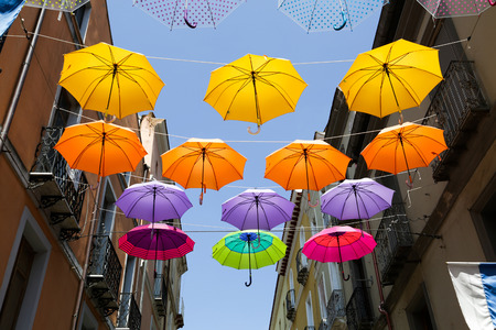 Colored parasols in the streets of Iglesias, Sardinia, Italyの写真素材