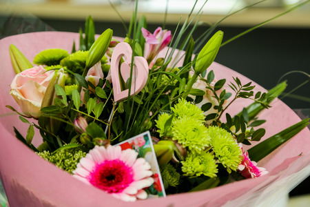 A beautiful flower bouquet with a romantic heartの写真素材