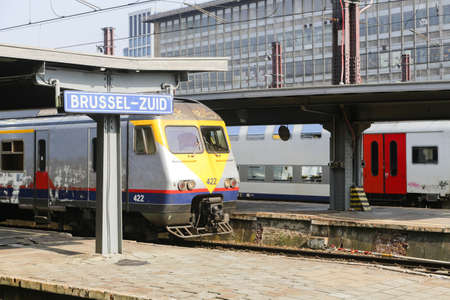 Rail tracks and trains in the Brussels South Railway Stationの写真素材