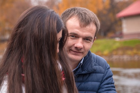 girl and boy stay together outdoorsの写真素材