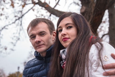 girl and boy stay together outdoorsの写真素材