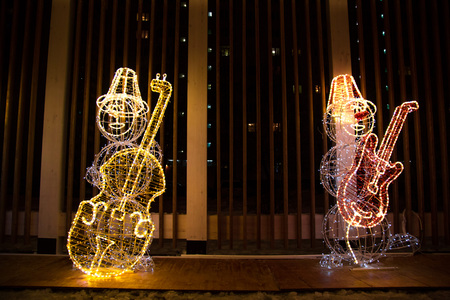 the snowman light installation in a parkの写真素材