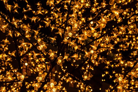 the light flower installation in a city at nightの写真素材