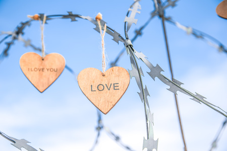 wooden hearts on the prison wallの写真素材