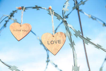 wooden hearts on the prison wallの写真素材