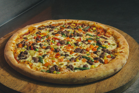 pizza on the wooden deskの写真素材