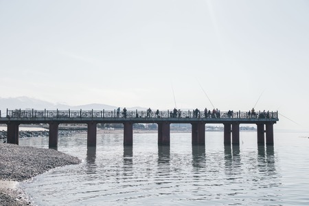 fishing on the bridge at the sea