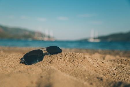 Sunglasses on the beachの写真素材