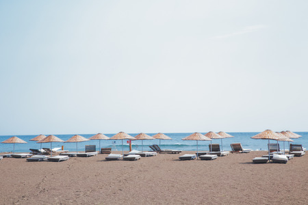 Beach umbrellas by the seaの写真素材