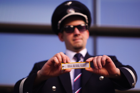Pilot holds a keychain IOSA BEFORE FLIGHTのeditorial素材