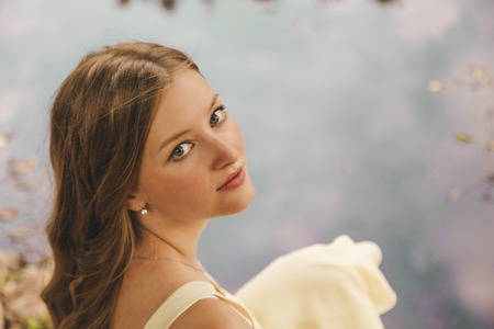 beautiful younge girl in a gardenの写真素材