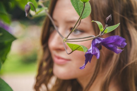 beautiful younge girl in a gardenの写真素材